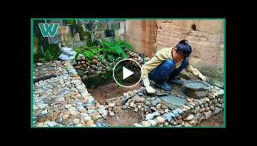 Young girl building and renovating a beautiful small garden with her own hands Young girl building and renovating a beautiful small garden with her own hands